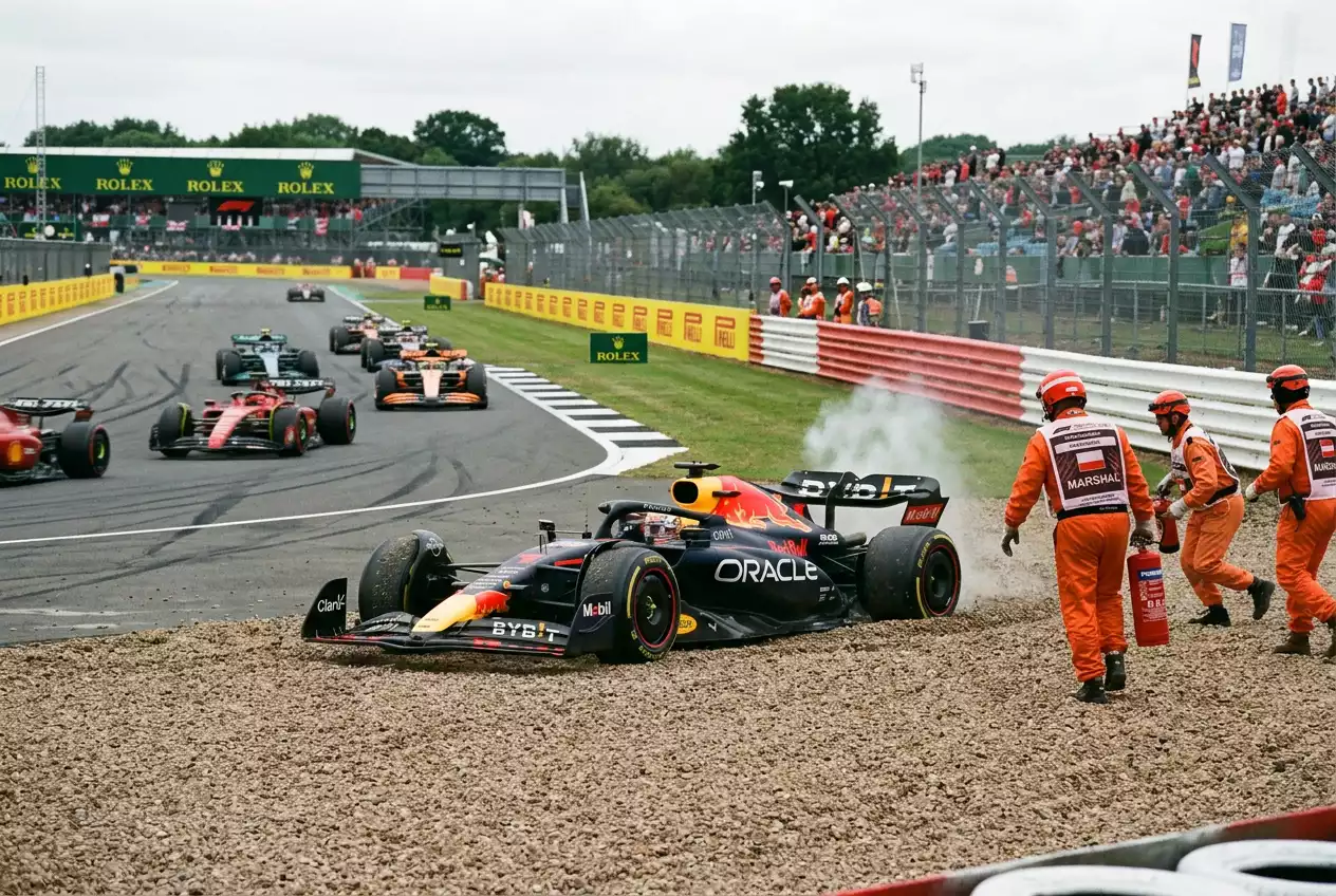 Formula 1 car parked in the gravel trap after a retirement showing DNF scenario relevant to betting markets
